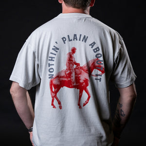 back of shirt illustration of will rogers on soapsude with Nothin Plain About it in an arched tet